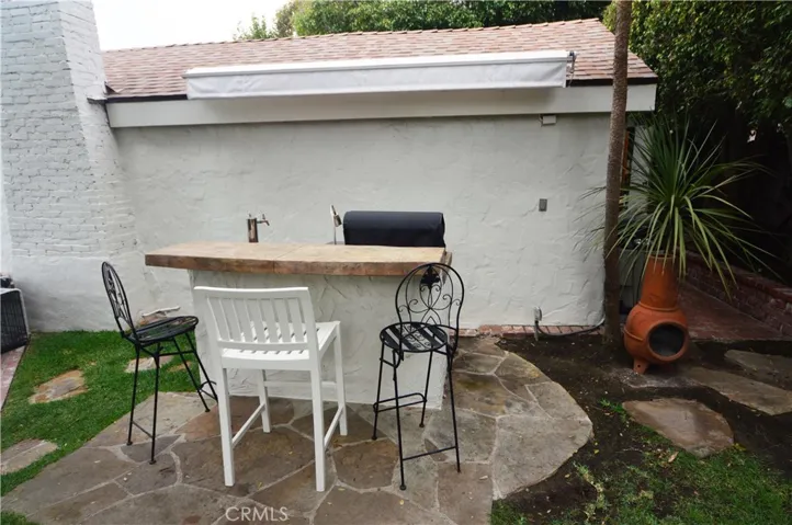Backyard bar and space for a grill.