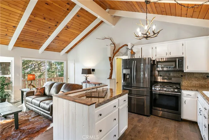 Main floor kitchen and living room leads to deck
