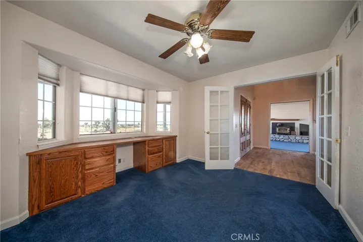 Downstairs den with builtin desk area