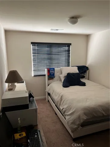 2nd largest bedroom with window facing front of  home.