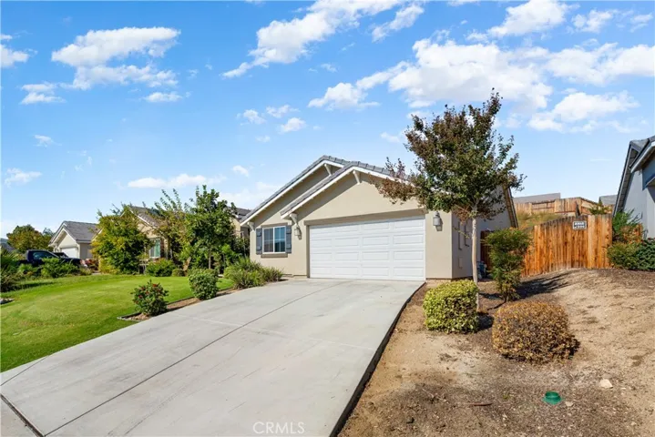 Wood fence to right is entry to the backyard.