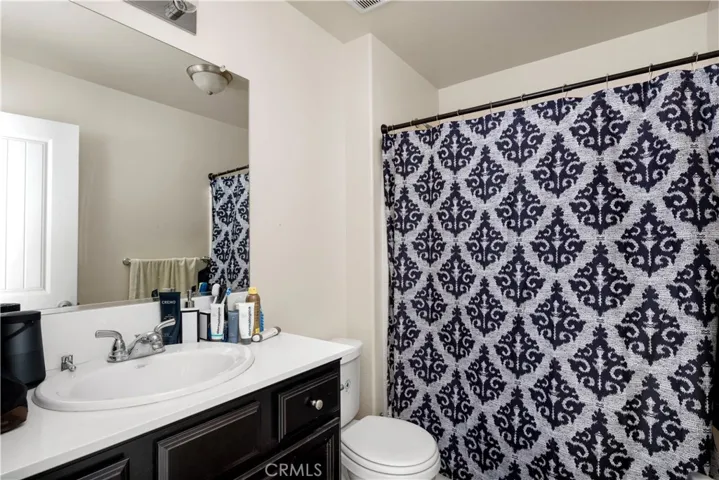 Hallway full bathroom with bathtub & shower.