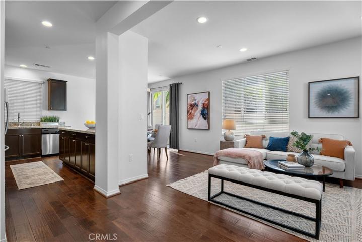 Spacious open floor plan with tons of light, engineered hardwood floors, granite countertops, recessed lights.