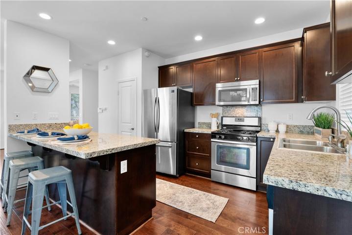 Kitchen with granite countertops, stainless steel appliances, and pantry!