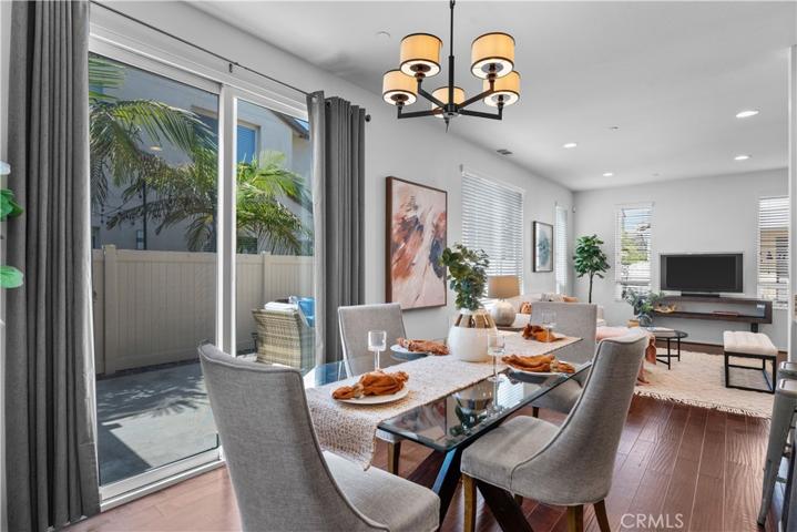 Dining area adjacent to kitchen and backyard.