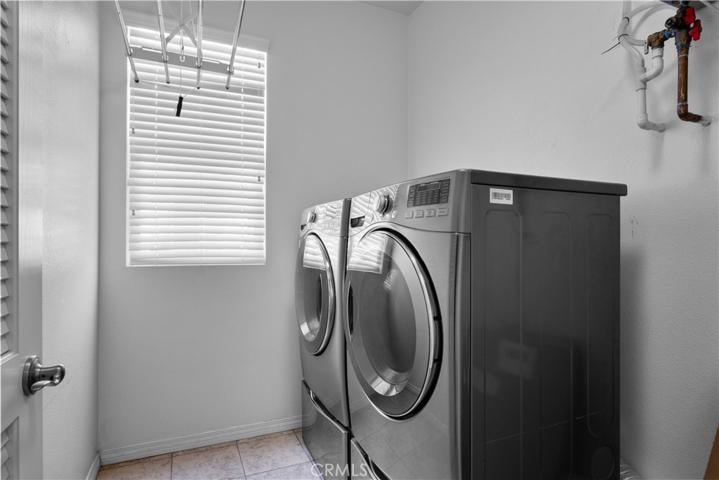 Separate upstairs laundry room.
