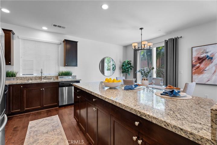 Granite countertops, all stainless steel appliances, engineered hardwood floors.