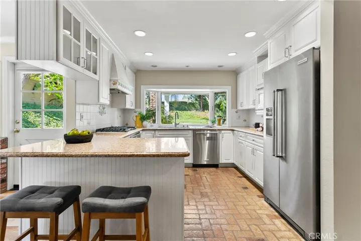 The kitchen opens to both the family room and the eating area.