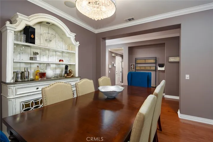 Dinning area! Table, 6 beige chairs and hutch included in price. Blue chairs NOT included.