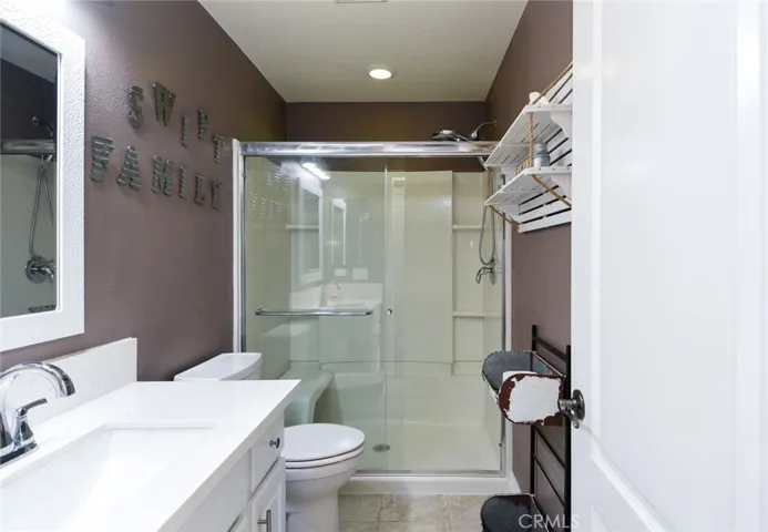 Full guest bathroom with Quartz counter.
