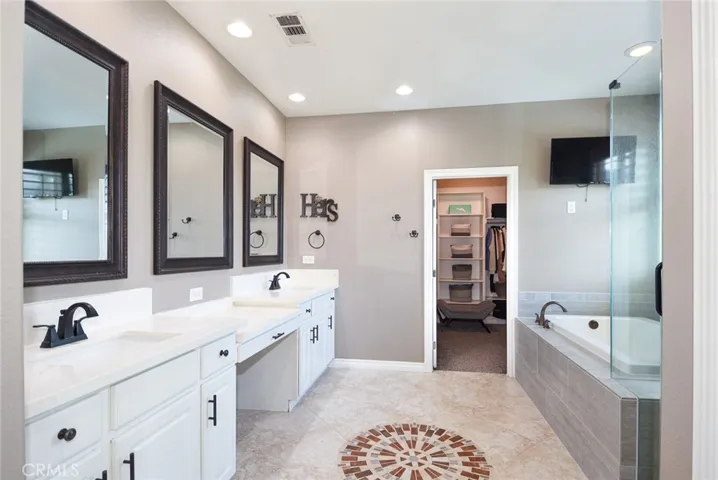 Remodeled Master bathroom with quartz counter tops.
