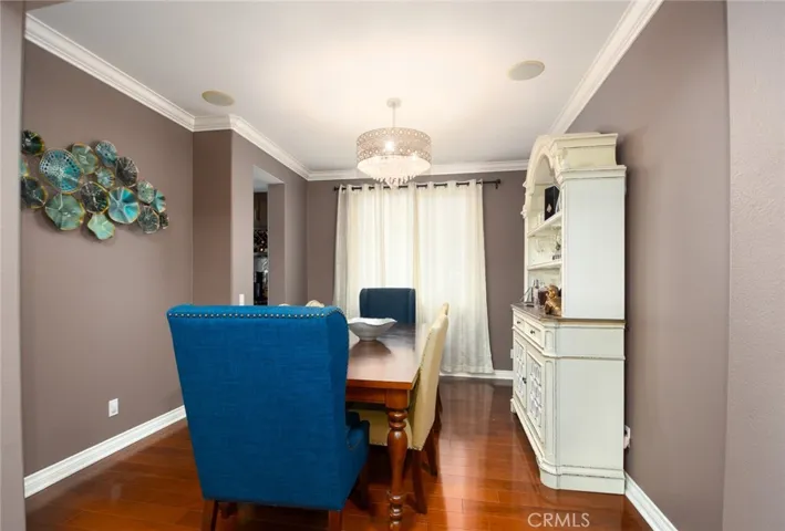 Dinning area! Blue chairs not included in price. Dinning table with 6 beige chairs and hutch included in price.