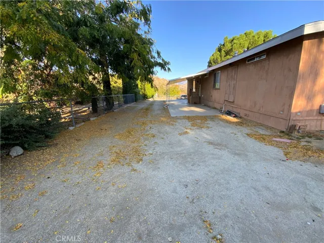 There is so much room on this lot for RVs, Boats, Recreational toys, extra vehicles, and a double gate for easy access to bring them onto the lot.