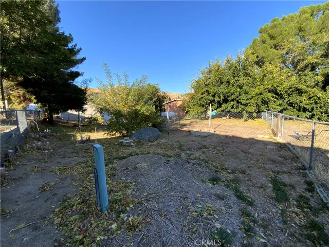 Large lot size has chain link fence separating lot.