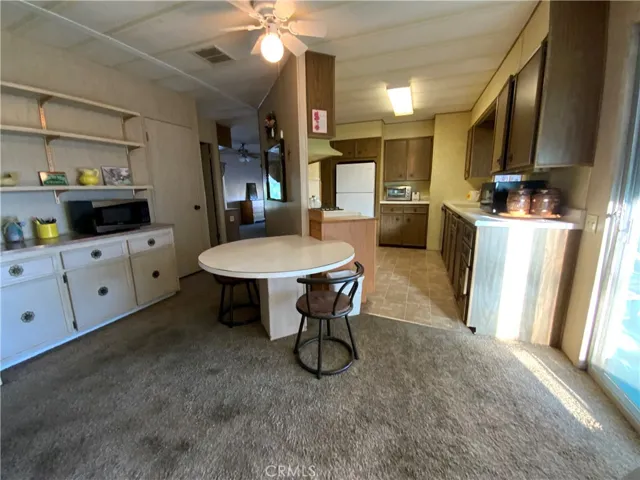 Having breakfast in this space next to the sliding glass doors that bring in the natural light will be a great start to your day.