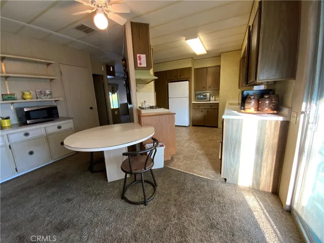 Built-in breakfast table and extra cabinets and shelves for convenience.