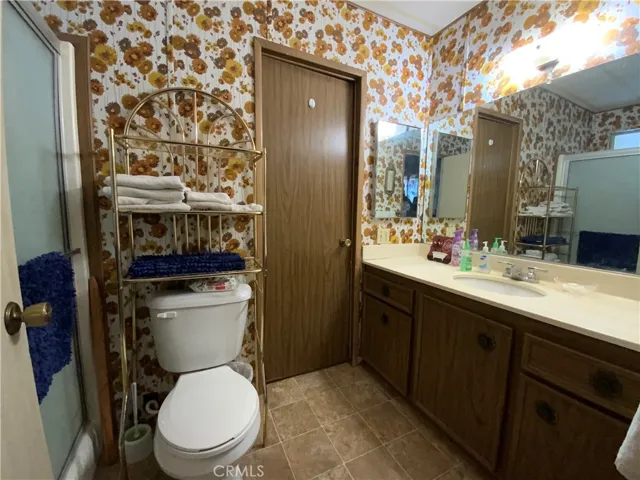 Bathroom #2 has two entrances, one for guests of the laundry room and one direct to bedroom #2.