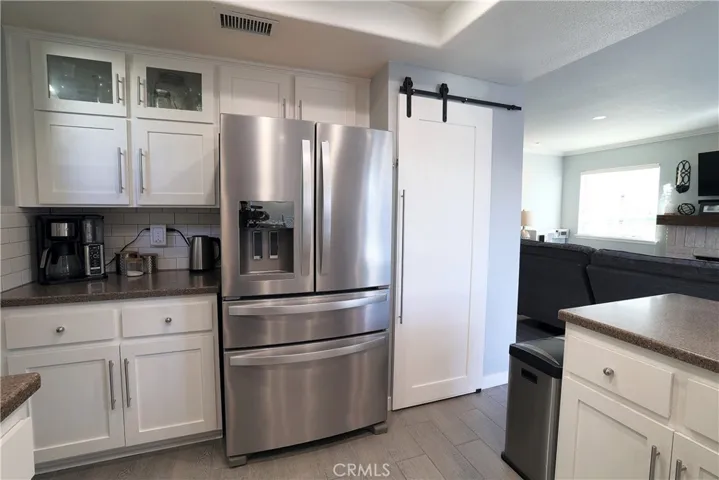 Stainless steel fridge and walk-in pantry