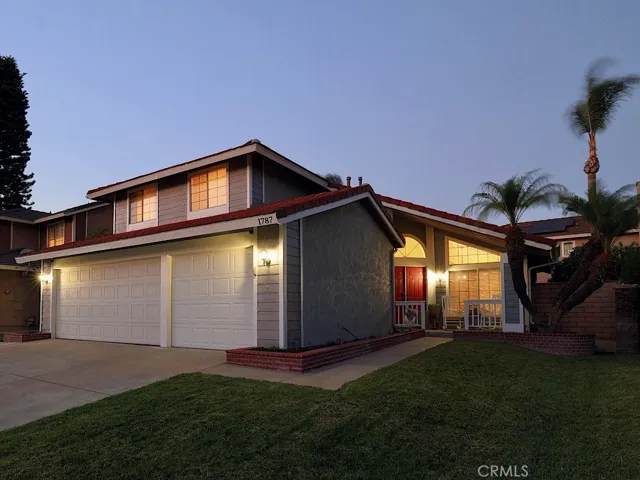 Front, evening. Exterior lighting