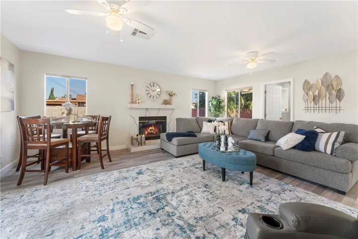 Isn't this just lovely? the family/dining that opens up from the kitchen area. The fireplace has quartz counters consistent with the kitchen tying it in together beautifully.