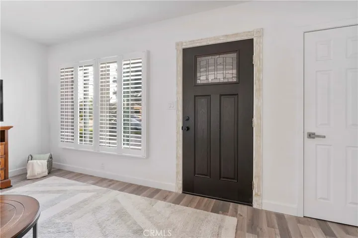 Newly updated living room. Closet on the right. Double pane windows with shutters. Luxury vinyl plank flooring and newly painted.