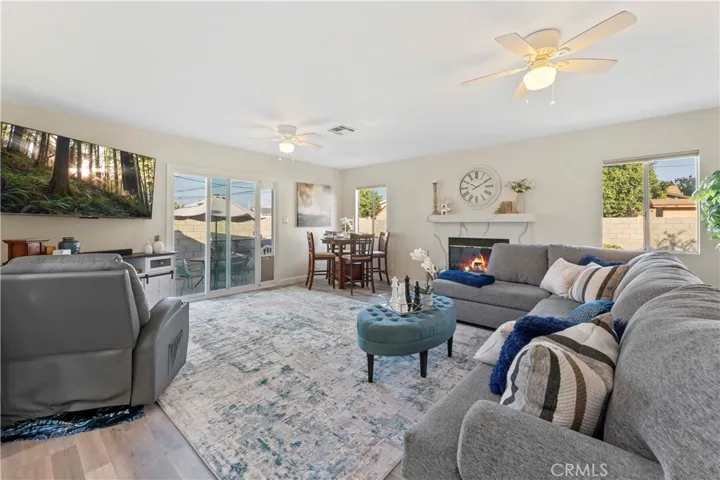 Isn't this just lovely? the family/dining that opens up from the kitchen area. The fireplace has quartz counters consistent with the kitchen tying it in together beautifully.