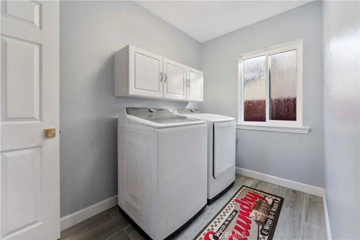Indoor laundry. Washer/Dryer included. Beautiful bamboo accent glass window for light and privacy.