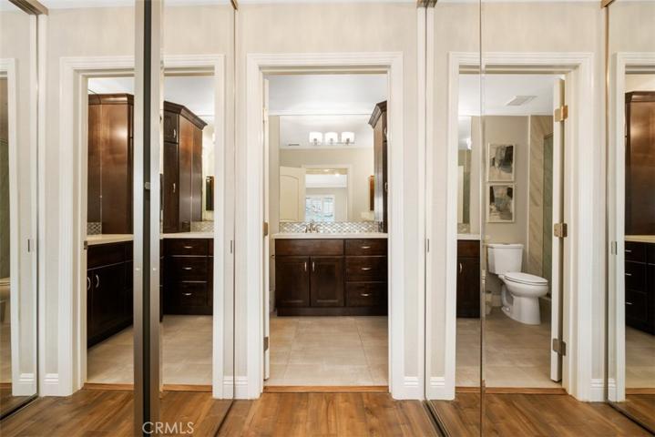 Primary bedroom mirrored closets