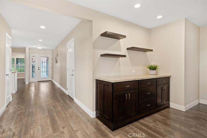 Extra storage and floating shelves in living room