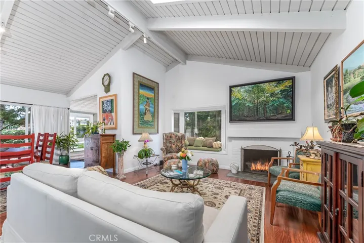 Living room is great room style open to the kitchen, dining room and den.