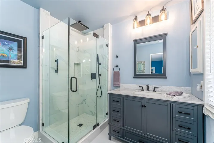 Primary en-suite bathroom has been beautifully remodeled