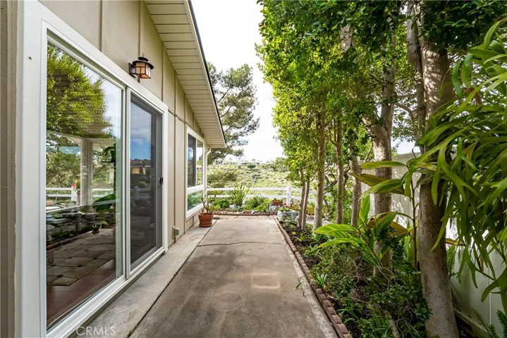 Wrap around yard. Private abound. Manicured landscape surrounds the home.