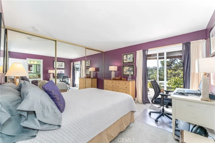 Socond suite is very large with a wall of closets, fantastic views and direct access to the bathroom.