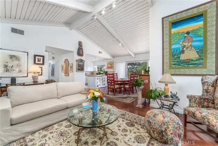 We love a mid-century home for numerous windows, abundance of light, designed to bring the feeling of the outoors being part of the  living space, tongue and groove wood and beams enhance the vibe.