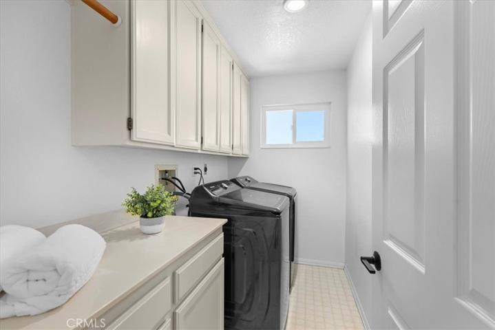 Upstairs dedicated laundry room.
