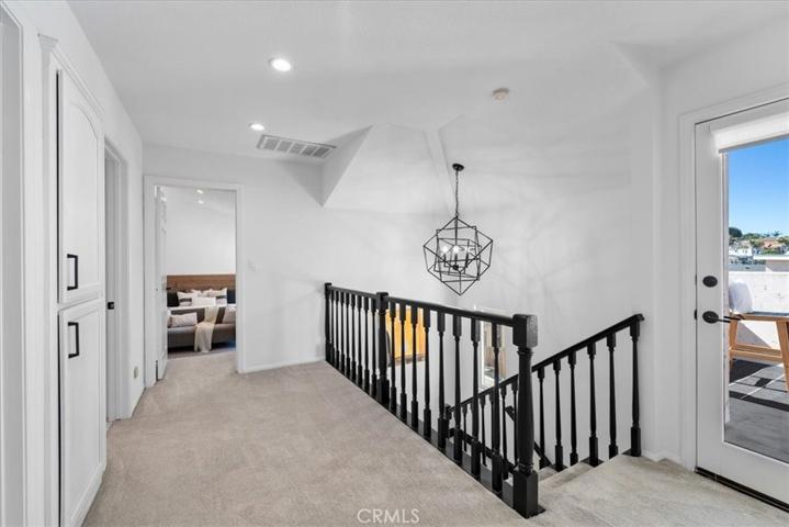 Staircase to hallway and deck.