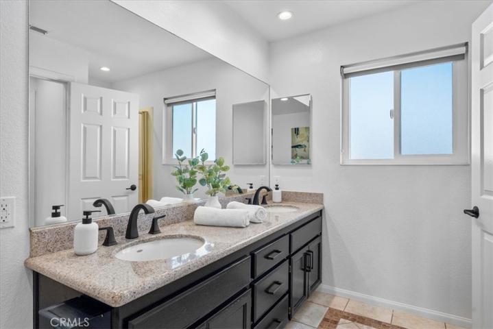 Primary bathroom, shower is behind door.