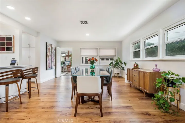 The dinning room opens up to the kitchen as well as the family room. Enjoy recessed lighting, open concept kitchen and new flooring throughout.
