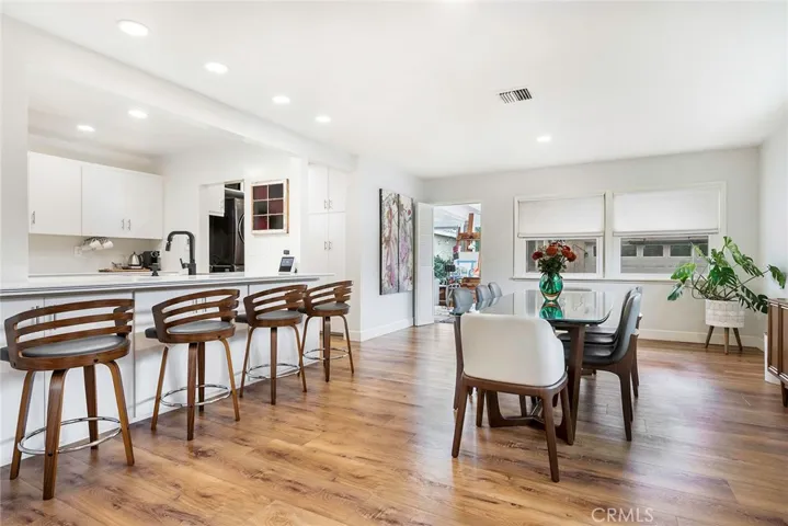 The dinning room opens up to the kitchen as well as the family room. Enjoy recessed lighting, open concept kitchen and new flooring throughout.