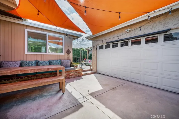 Incredible use of space in the backyard is a built in seat where you can gather outside for a farm to table dinner!