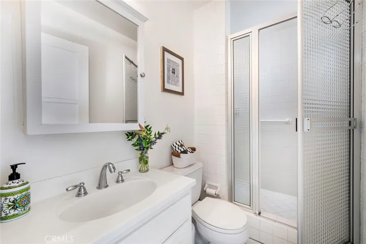 Primary suite bathroom with standing shower.