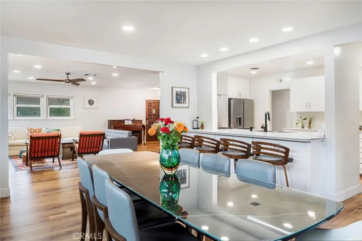 The dinning room opens up to the kitchen as well as the family room. Enjoy recessed lighting, open concept kitchen and new flooring throughout.