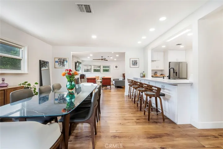 The dinning room opens up to the kitchen as well as the family room. Enjoy recessed lighting, open concept kitchen and new flooring throughout.