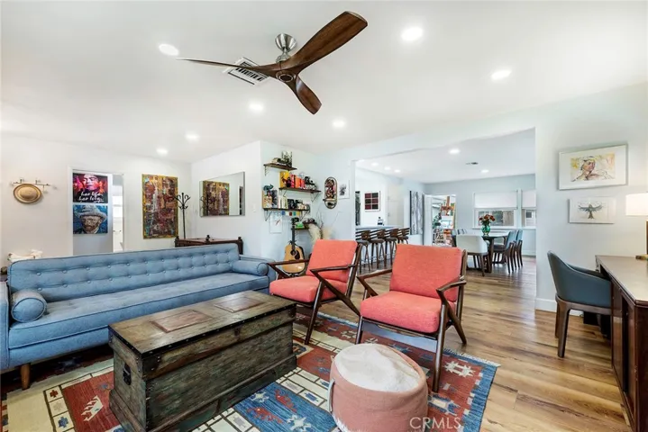 Beautiful family room with recessed lighting, LVT floors and modern fireplace.