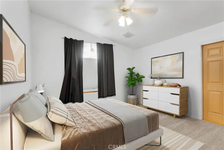 Guest Bedroom 1 with door leading to side yard