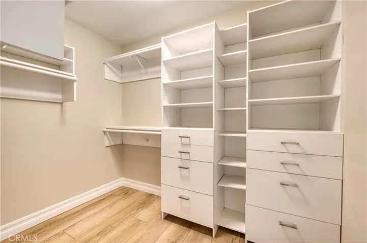 Primary bedroom walk-in closet