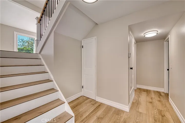 Entry hallway to bedroom 1 and 2 - stairs to living room