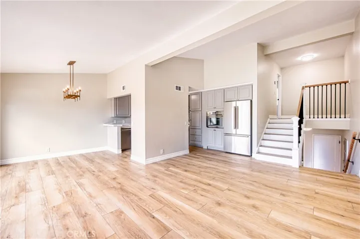 Living room looking into dining room and kitchen