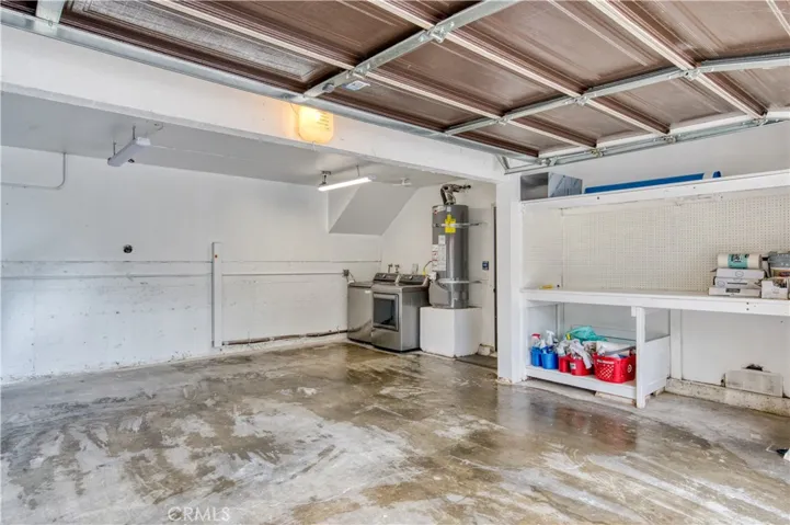 Garage with washer and dryer and workbench