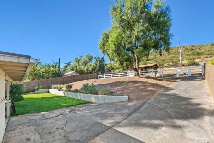 This is the exterior back showing the back yard and the large bonus space above, roughly 60'x100'.